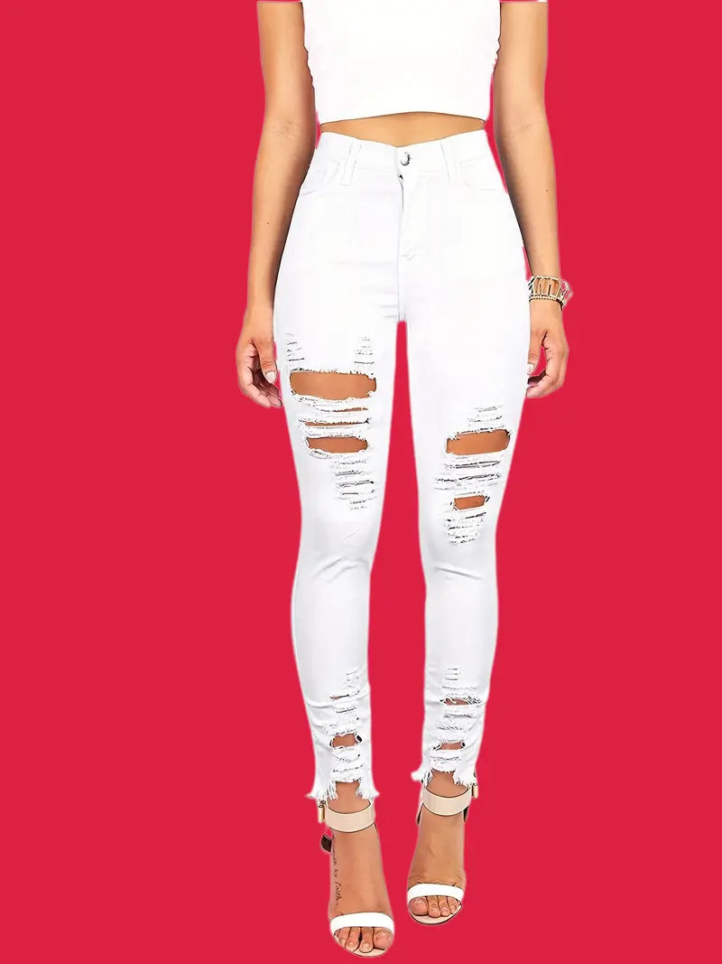High-waisted skinny jeans with rips and raw hem